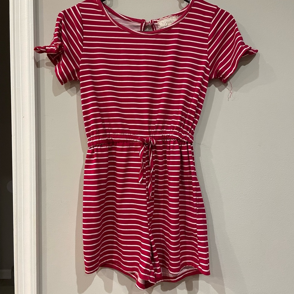 This is a red large kid romper by between